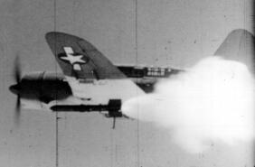 Tiny Tim rocket being test fired from a SB2C Helldiver