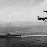 1280px-USS_Essex_(CV-9)_with_TG_38_3_off_Okinawa_1945