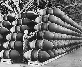 An american worker inspects 1,000lb bomb cases before they are filled with explosives