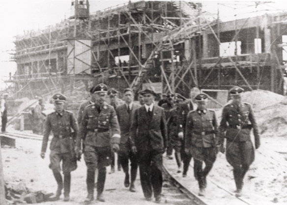 Reichsfuehrer SS Heinrich Himmler tours the Monowitz-Buna building site in the company of SS officers and IG Farben engineers