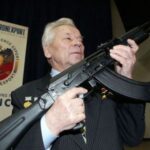 Designer_Mikhail_Kalashnikov_poses_with_its_AK-74_assaul_rifle_640_001