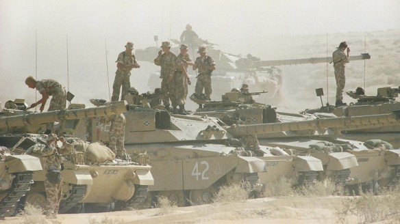 Tank crews with the British 7th Armoured Brigade stand atop their Challenger tanks after a simulated battle in the dusty eastern Saudi Arabian desert, Saturday, Dec. 1, 1990 in Saudi Arabia. (AP Photo/Diether Endlicher)